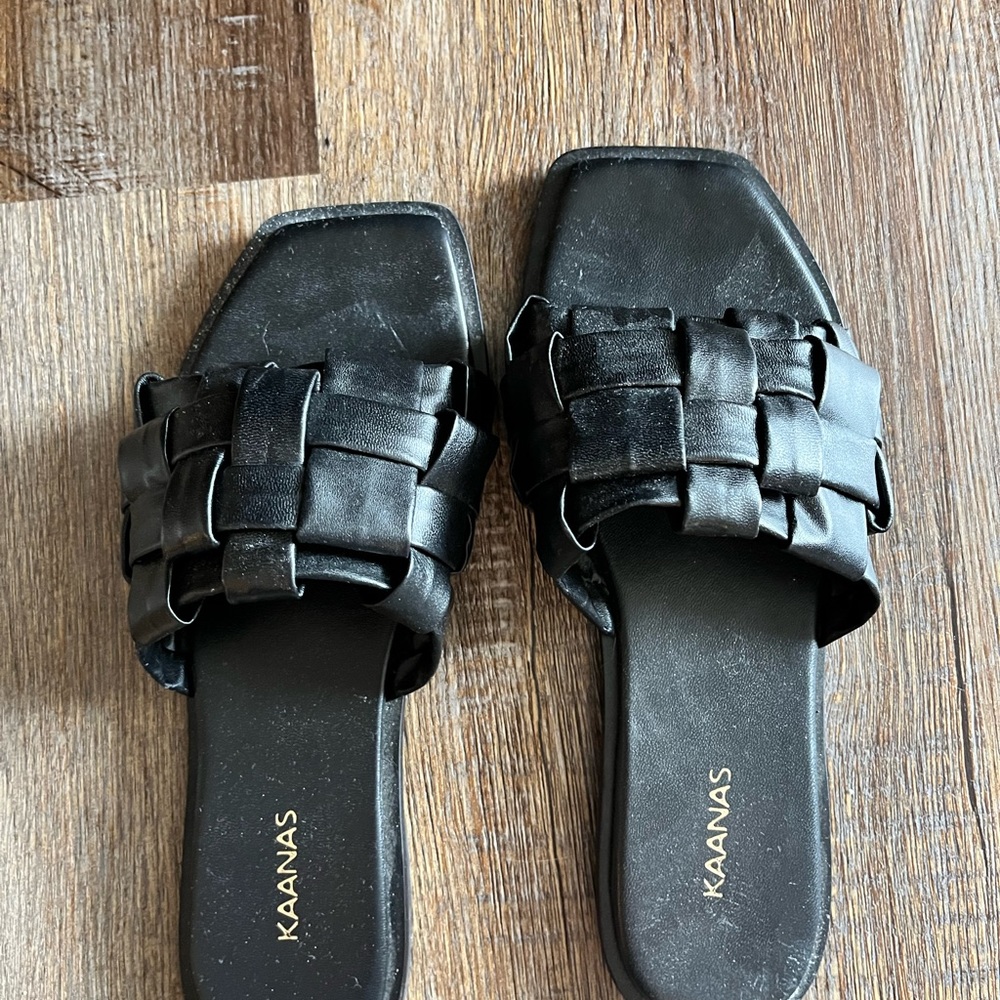 Women’s black leather slides
